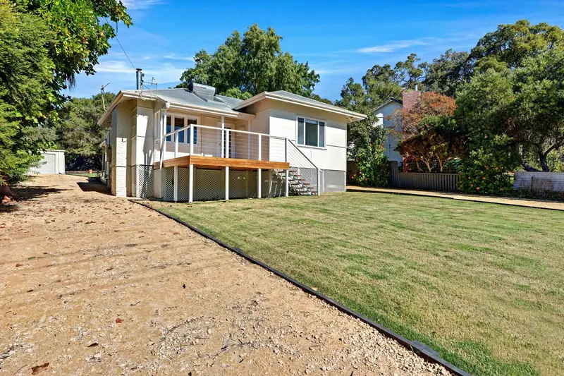 Renovated weatherboard home with new front deck and stairs